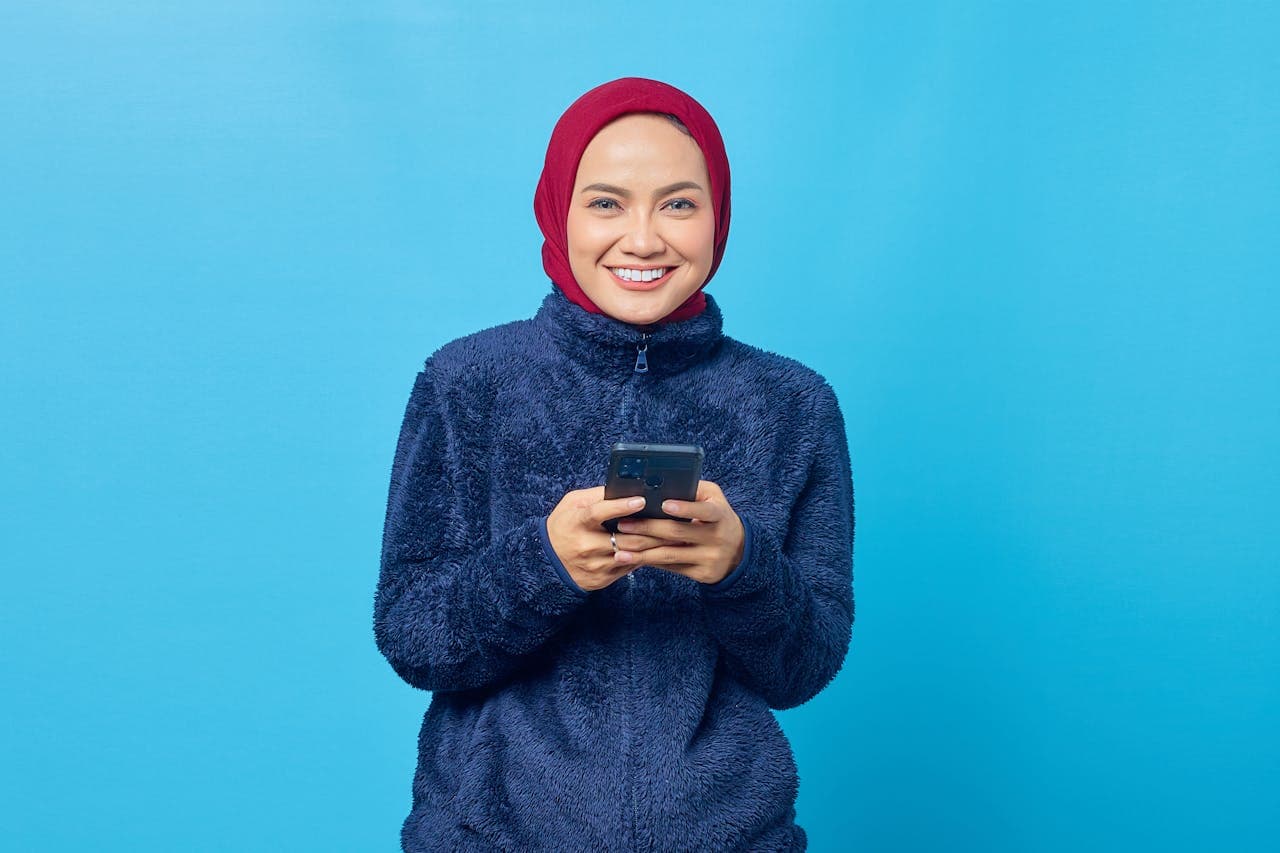 Beautiful Young Woman in Red Hijab and Blue Fur Jacket
