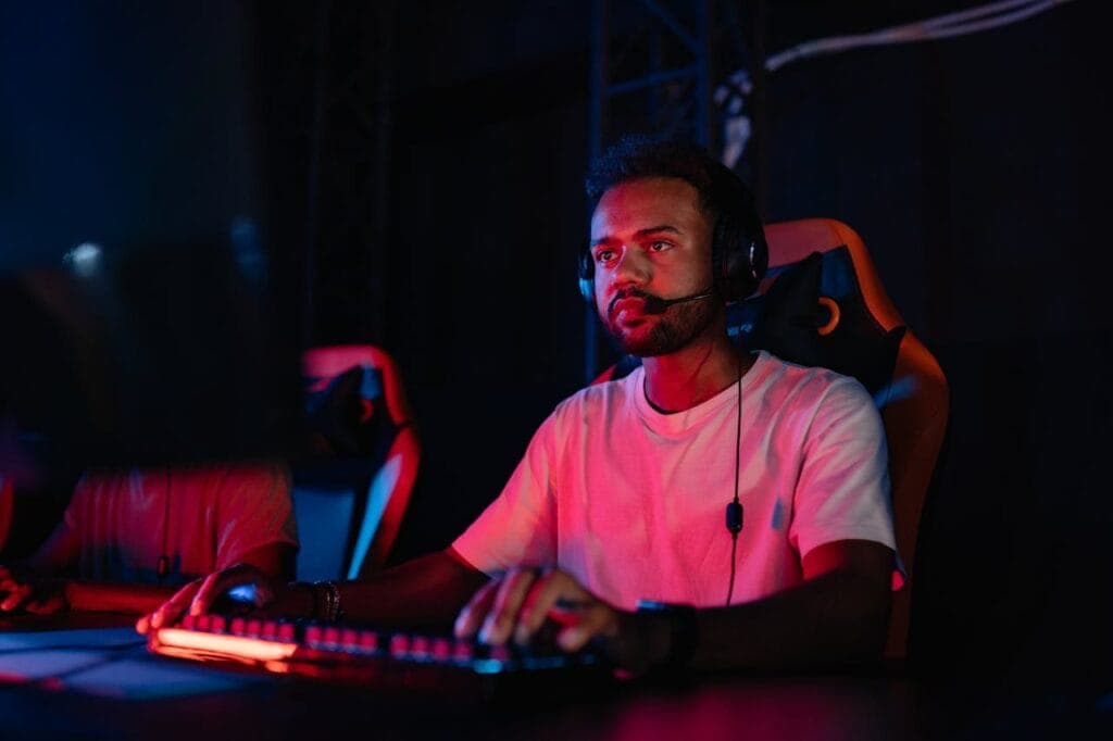 Man in a White Shirt Playing on a Computer